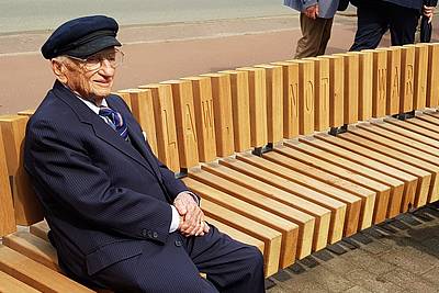Ben Ferencz on the bench, which he donated to the city of The Hague, next to the Peace Palace.