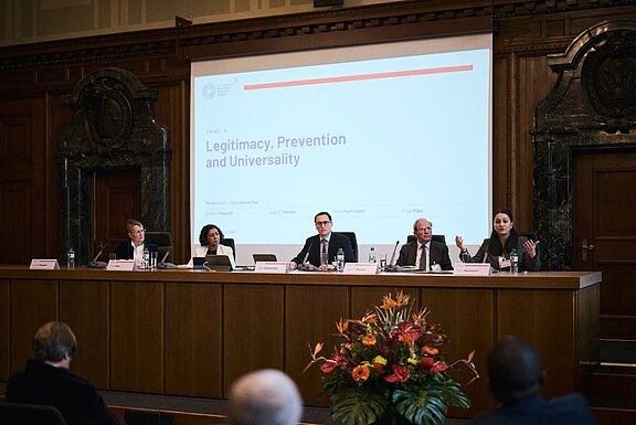 Panel V titled “Legitimacy, Prevention and Universality”