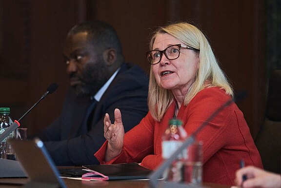 Päivi Kaukoranta (right) and Dr Ousman Njikam (left)