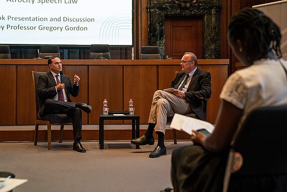 Prof._Gregory_Gordon_discussing_with_Klaus_Rackwitz__Director_of_the_Nuremberg_Academy_LER7547.jpg  